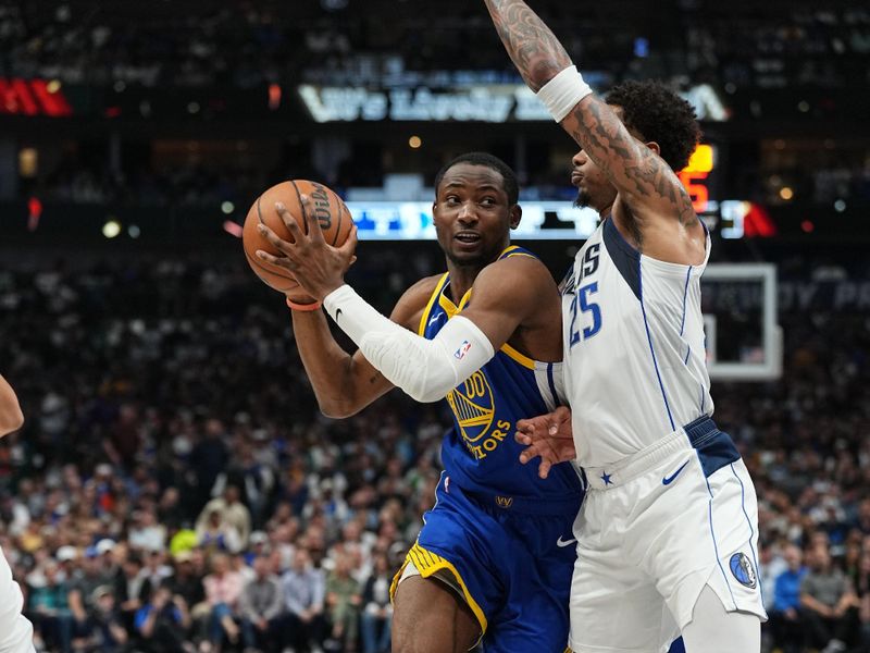 DALLAS, TX - MARCH 13: Jonathan Kuminga #00 of the Golden State Warriors drives to the basket during the game against the Dallas Mavericks on March 13, 2024 at the American Airlines Center in Dallas, Texas. NOTE TO USER: User expressly acknowledges and agrees that, by downloading and or using this photograph, User is consenting to the terms and conditions of the Getty Images License Agreement. Mandatory Copyright Notice: Copyright 2024 NBAE (Photo by Glenn James/NBAE via Getty Images)