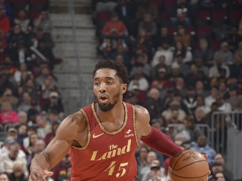 CLEVELAND, OH - FEBRUARY 12: Donovan Mitchell #45 of the Cleveland Cavaliers handles the ball during the game against the Philadelphia 76ers on February 12, 2024 at Rocket Mortgage FieldHouse in Cleveland, Ohio. NOTE TO USER: User expressly acknowledges and agrees that, by downloading and/or using this Photograph, user is consenting to the terms and conditions of the Getty Images License Agreement. Mandatory Copyright Notice: Copyright 2024 NBAE (Photo by David Liam Kyle/NBAE via Getty Images)