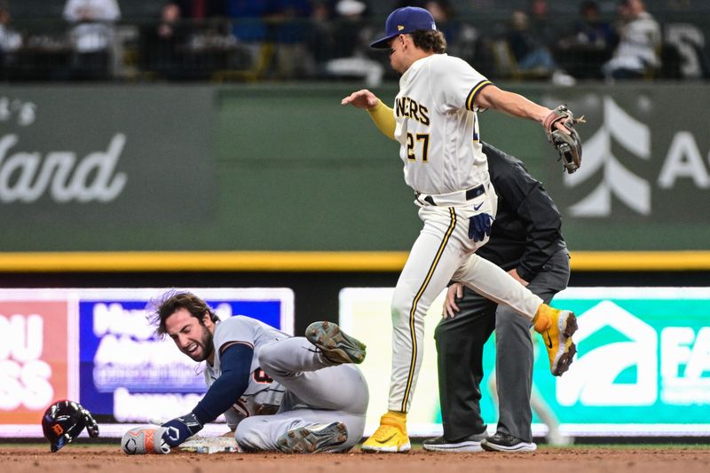 Apr 26, 2023; Milwaukee, Wisconsin, USA; Detroit Tigers right fielder Matt Vierling (8) reaches second base before the tag by Milwaukee Brewers shortstop Willy Adames (27) for a double in the third inning at American Family Field. Mandatory Credit: Benny Sieu-USA TODAY Sports
