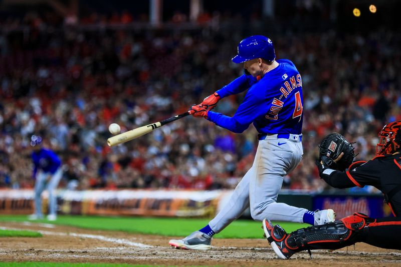 May 23, 2025; Cincinnati, Ohio, USA; Chicago Cubs outfielder Pete Crow-Armstrong (4) hits a grand slam in the seventh inning against the Cincinnati Reds at Great American Ball Park. Mandatory Credit: Katie Stratman-Imagn Images