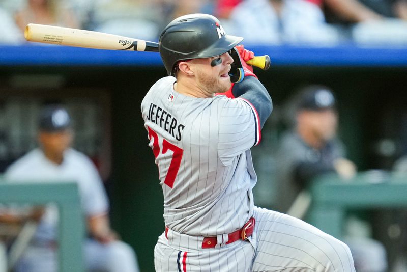 Jul 28, 2023; Kansas City, Missouri, USA; Minnesota Twins catcher Ryan Jeffers (27) hits an RBI single during the fourth inning against the Kansas City Royals at Kauffman Stadium. Mandatory Credit: Jay Biggerstaff-USA TODAY Sports