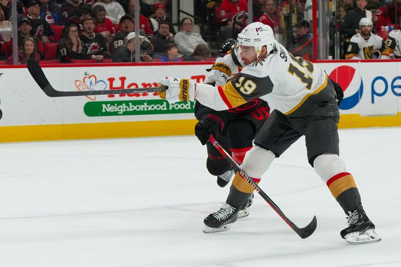 Mar 11, 2023; Raleigh, North Carolina, USA;  Vegas Golden Knights right wing Reilly Smith (19) scores a goal against the Carolina Hurricanes during the second period at PNC Arena. Mandatory Credit: James Guillory-USA TODAY Sports