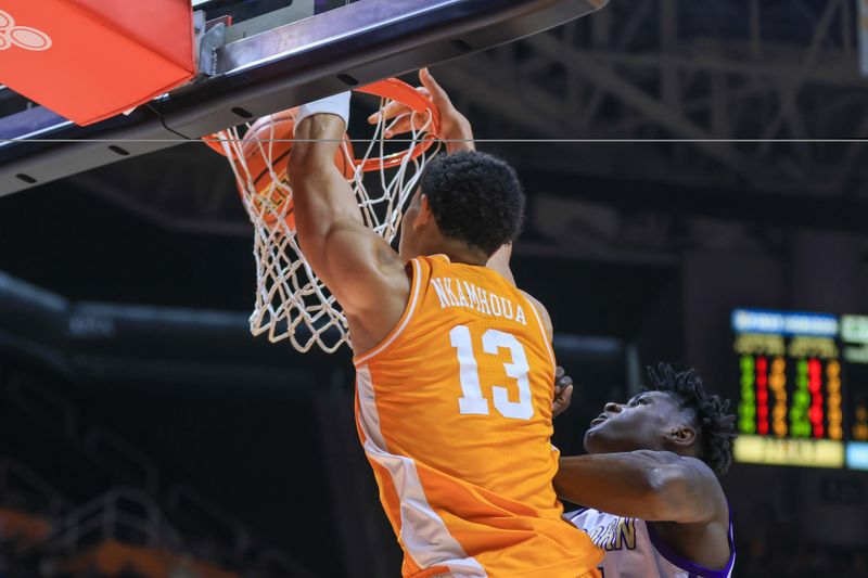 Dec 4, 2022; Knoxville, Tennessee, USA; Tennessee Volunteers forward Olivier Nkamhoua (13) dunks the ball against the Alcorn State Braves at Thompson-Boling Arena. Mandatory Credit: Randy Sartin-USA TODAY Sports