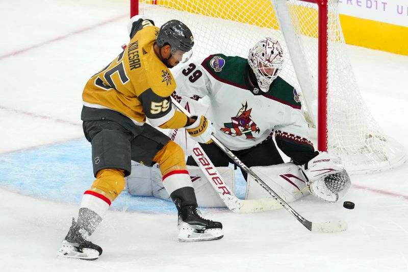 Nov 25, 2023; Las Vegas, Nevada, USA; Arizona Coyotes goaltender Connor Ingram (39) defends his net against Vegas Golden Knights right wing Keegan Kolesar (55) during the third period at T-Mobile Arena. Mandatory Credit: Stephen R. Sylvanie-USA TODAY Sports