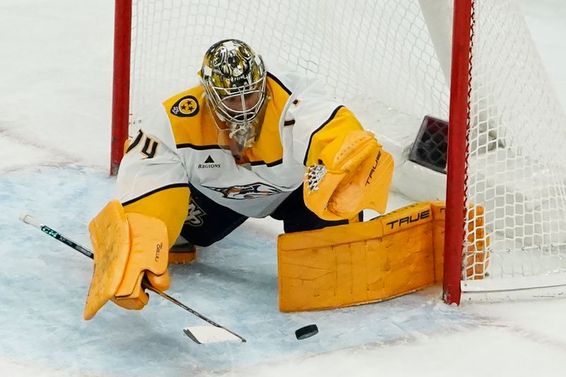 Nov 28, 2025; Chicago, Illinois, USA; Nashville Predators goaltender Juuse Saros (74) makes a save against the Chicago Blackhawks during the second period at United Center. Mandatory Credit: David Banks-Imagn Images