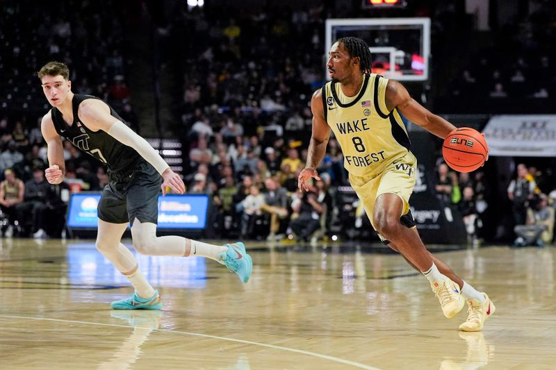 Jan 3, 2026; Winston-Salem, North Carolina, USA; Wake Forest Demon Deacons guard Mekhi Mason (8) handles the ball against Virginia Tech Hokies during the first half at Lawrence Joel Veterans Memorial Coliseum. Mandatory Credit: Jim Dedmon-Imagn Images