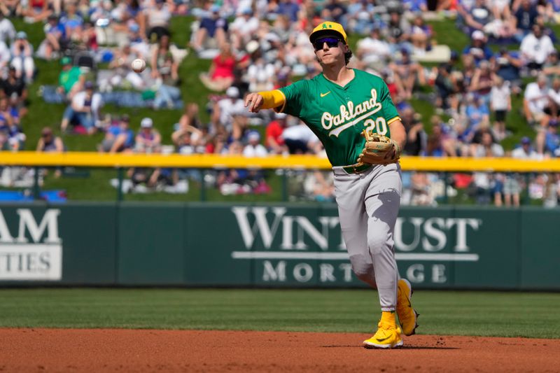 Mar 14, 2024; Mesa, Arizona, USA; Oakland Athletics second baseman Zack Gelof (20) makes the play for an out against the Chicago Cubs in the first inning at Sloan Park. Mandatory Credit: Rick Scuteri-USA TODAY Sports