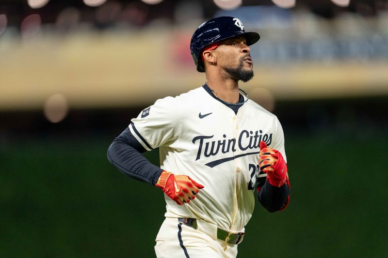 Apr 23, 2024; Minneapolis, Minnesota, USA; Minnesota Twins outfielder Byron Buxton (25) hits a solo home run in the ninth inning against the Chicago White Sox at Target Field. Mandatory Credit: Matt Blewett-USA TODAY Sports