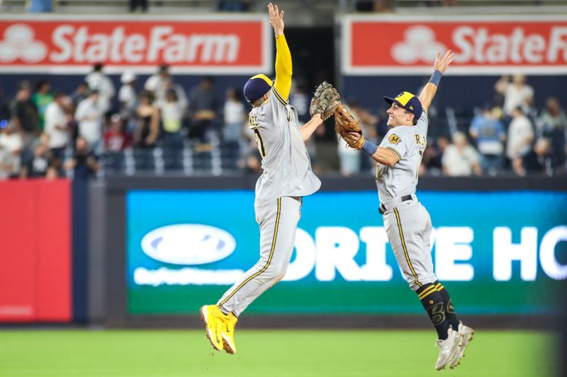 Sep 8, 2023; Bronx, New York, USA;  Milwaukee Brewers shortstop Willy Adames (27) and Milwaukee Brewers center fielder Sal Frelick (10) celebrate after defeating the New York Yankees 8-2 at Yankee Stadium. Mandatory Credit: Wendell Cruz-USA TODAY Sports