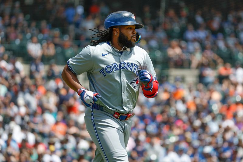 May 25, 2024; Detroit, Michigan, USA; Toronto Blue Jays first baseman Vladimir Guerrero Jr. (27) runs to first during an at bat in the first inning of the game against the the Detroit Tigers at Comerica Park. Mandatory Credit: Brian Bradshaw Sevald-USA TODAY Sports