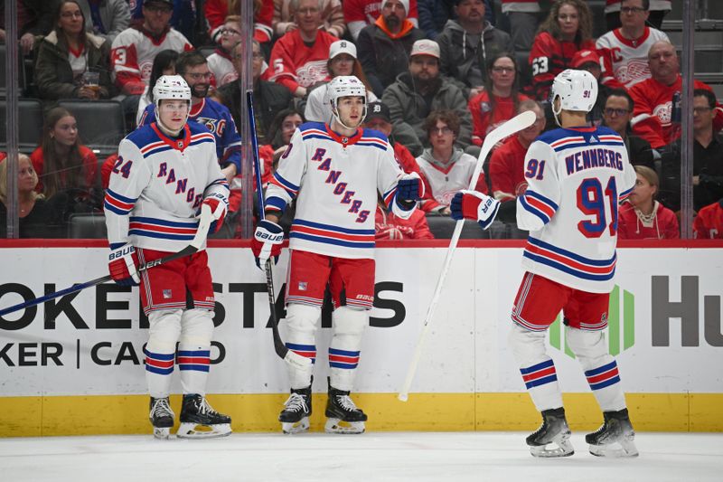 Apr 5, 2024; Detroit, Michigan, USA; New York Rangers left wing Will Cuylle (50) celebrates his with right wing Kaapo Kakko (24) and center Alex Wennberg (91) during the first period against the Detroit Red Wings at Little Caesars Arena. Mandatory Credit: Tim Fuller-USA TODAY Sports