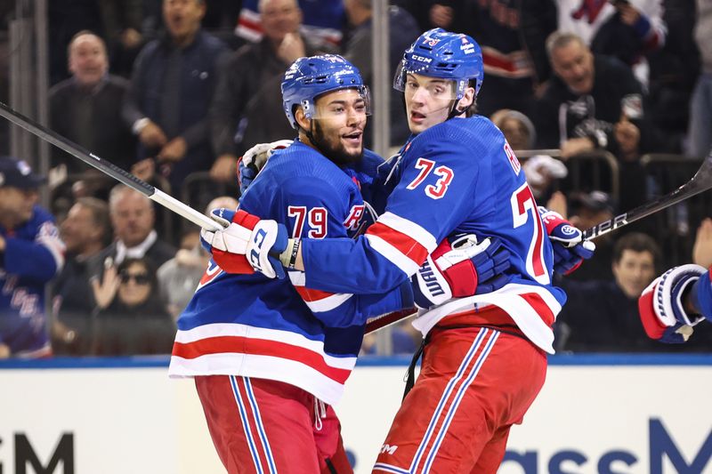 Apr 21, 2024; New York, New York, USA; New York Rangers center Matt Rempe (73) celebrates with defenseman K'Andre Miller (79) after scoring a goal in the second period against the Washington Capitals in game one of the first round of the 2024 Stanley Cup Playoffs at Madison Square Garden. Mandatory Credit: Wendell Cruz-USA TODAY Sports