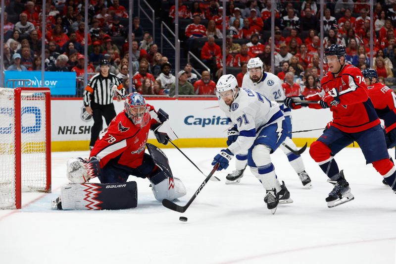 Apr 13, 2024; Washington, District of Columbia, USA; Washington Capitals goaltender Charlie Lindgren (79) prepares to make a save on Tampa Bay Lightning center Anthony Cirelli (71) as Capitals defenseman John Carlson (74) defends in the second period at Capital One Arena. Mandatory Credit: Geoff Burke-USA TODAY Sports