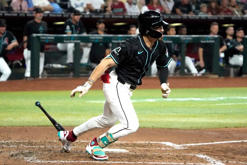 Jun 14, 2024; Phoenix, Arizona, USA; Arizona Diamondbacks outfielder Corbin Carroll (7) hits an RBI single against the Chicago White Sox in the fourth inning at Chase Field. Mandatory Credit: Rick Scuteri-USA TODAY Sports