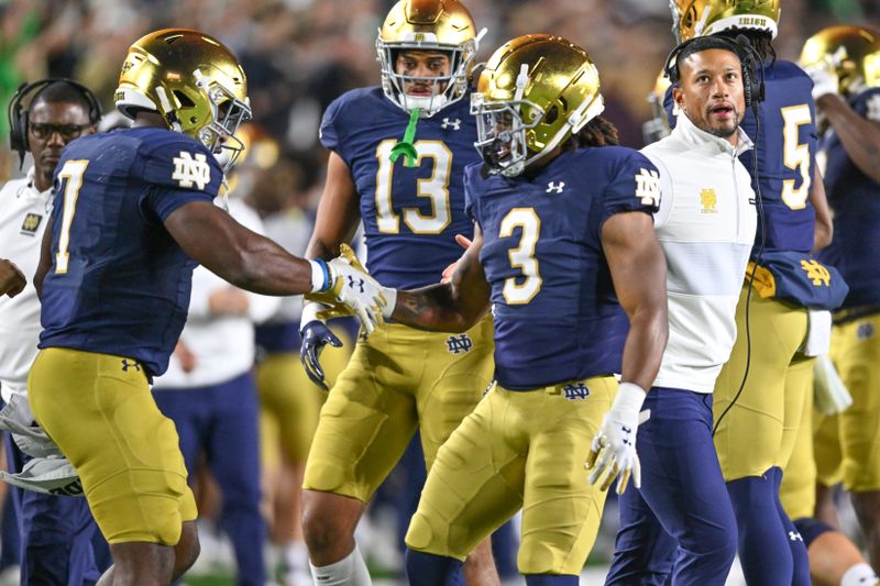 Oct 14, 2023; South Bend, Indiana, USA; Notre Dame Fighting Irish running back Gi'Bran Payne (3) celebrates with running back Audric Estime (7) after Payne scored a touchdown in the first quarter against the USC Trojans at Notre Dame Stadium. Mandatory Credit: Matt Cashore-USA TODAY Sports