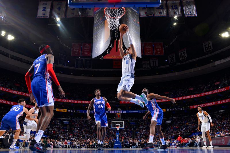 PHILADELPHIA, PA - MARCH 29: Josh Green #8 of the Dallas Mavericks drives to the basket during the game against the Philadelphia 76ers on March 29, 2023 at the Wells Fargo Center in Philadelphia, Pennsylvania NOTE TO USER: User expressly acknowledges and agrees that, by downloading and/or using this Photograph, user is consenting to the terms and conditions of the Getty Images License Agreement. Mandatory Copyright Notice: Copyright 2023 NBAE (Photo by Jesse D. Garrabrant/NBAE via Getty Images)