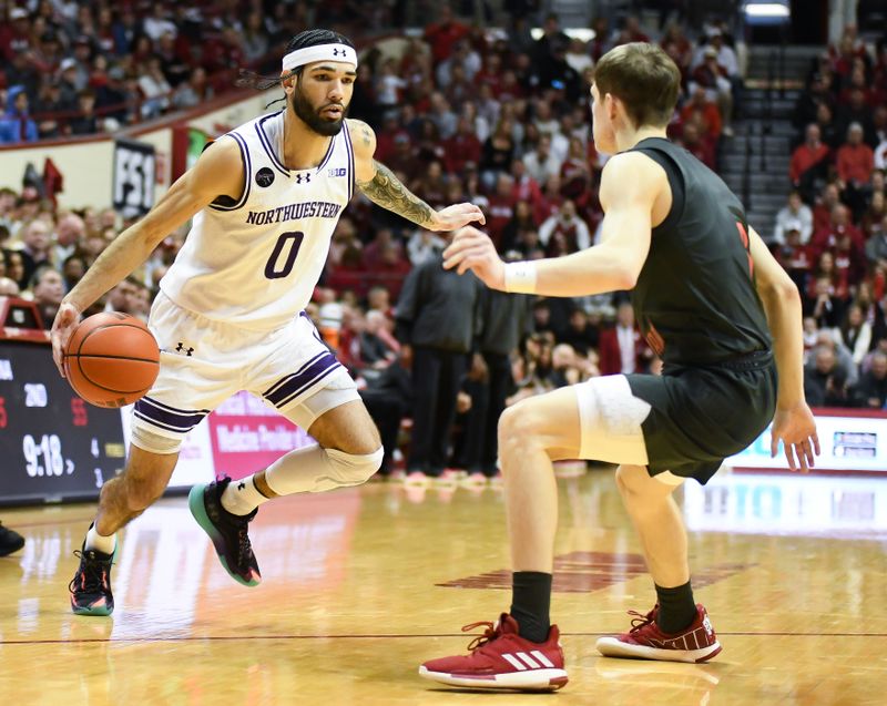 Feb 18, 2024; Bloomington, Indiana, USA;  Northwestern Wildcats guard Boo Buie (0) dribbles the ball against Indiana Hoosiers guard Gabe Cupps (2) during the second half at Simon Skjodt Assembly Hall. Mandatory Credit: Robert Goddin-USA TODAY Sports