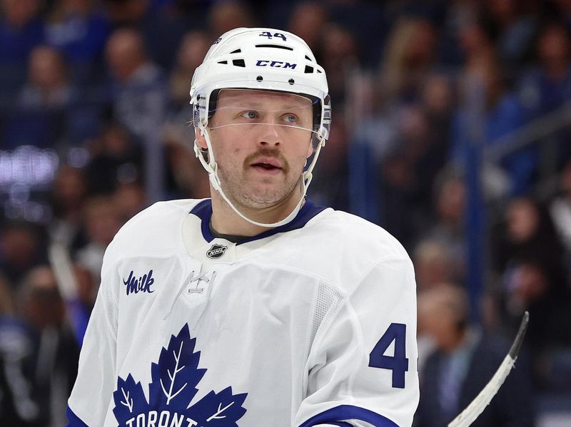 Nov 30, 2024; Tampa, Florida, USA; Toronto Maple Leafs defenseman Morgan Rielly (44) looks on against the Tampa Bay Lightning during the second period at Amalie Arena. Mandatory Credit: Kim Klement Neitzel-Imagn Images