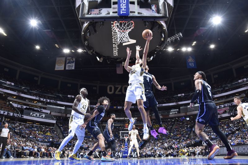 ORLANDO, FL - OCTOBER 28: Ben Sheppard #26 of the Indiana Pacers drives to the basket during the game against the Orlando Magic on October 28, 2024 at Kia Center in Orlando, Florida. NOTE TO USER: User expressly acknowledges and agrees that, by downloading and or using this photograph, User is consenting to the terms and conditions of the Getty Images License Agreement. Mandatory Copyright Notice: Copyright 2024 NBAE (Photo by Fernando Medina/NBAE via Getty Images)