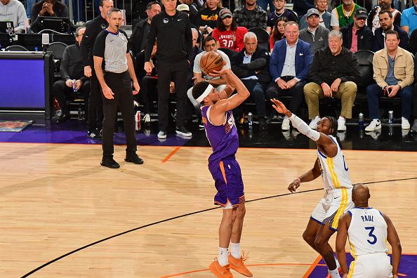 PHOENIX, AZ - DECEMBER 12: Devin Booker #1 of the Phoenix Suns shoots the ball during the game against the Golden State Warriors on December 12, 2023 at Footprint Center in Phoenix, Arizona. NOTE TO USER: User expressly acknowledges and agrees that, by downloading and or using this photograph, user is consenting to the terms and conditions of the Getty Images License Agreement. Mandatory Copyright Notice: Copyright 2023 NBAE (Photo by Kate Frese/NBAE via Getty Images)