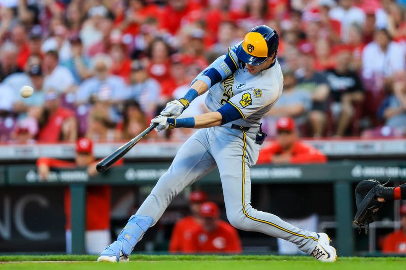 Jun 2, 2025; Cincinnati, Ohio, USA; Milwaukee Brewers designated hitter Christian Yelich (22) hits a solo home run in the third inning against the Cincinnati Reds at Great American Ball Park. Mandatory Credit: Katie Stratman-Imagn Images