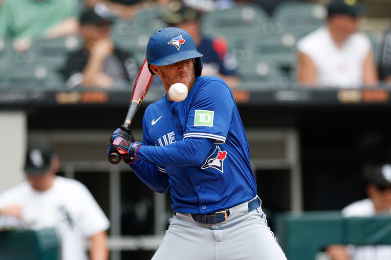 Jul 9, 2025; Chicago, Illinois, USA; Toronto Blue Jays center fielder Myles Straw (3) is hit by a wild pitch from Chicago White Sox starting pitcher Adrian Houser during the second inning at Rate Field. Mandatory Credit: Kamil Krzaczynski-Imagn Images