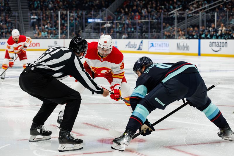 Oct 19, 2024; Seattle, Washington, USA; Calgary Flames center Nazem Kadri (91) prepares to face off against Seattle Kraken center Chandler Stephenson (9) during the second period at Climate Pledge Arena. Mandatory Credit: Caean Couto-Imagn Images