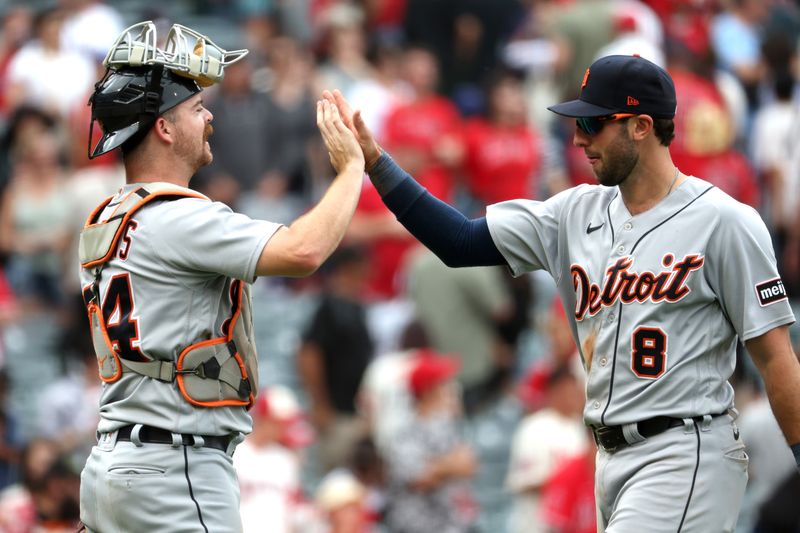 Sep 17, 2023; Anaheim, California, USA;  Detroit Tigers catcher Jake Rogers (34) and left fielder Matt Vierling (8) celebrate a victory after defeating the Los Angeles Angels 5-3 at Angel Stadium. Mandatory Credit: Kiyoshi Mio-USA TODAY Sports