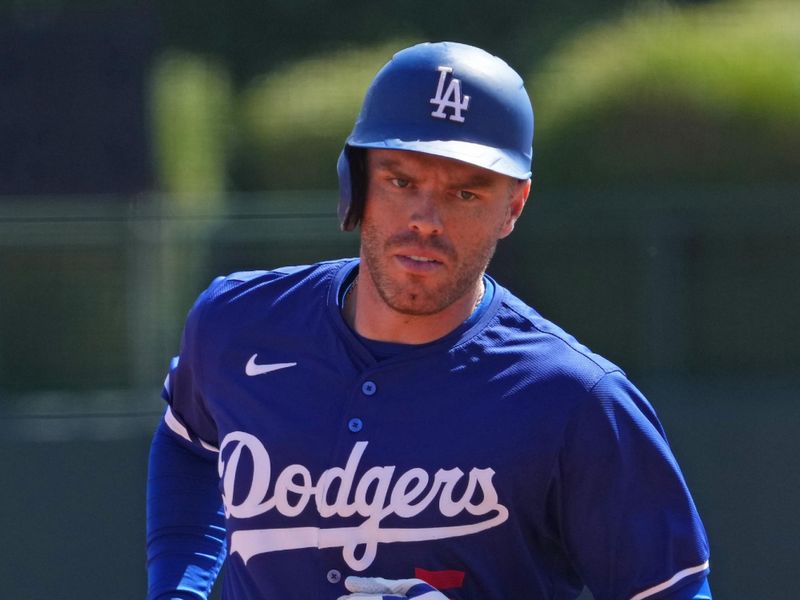 Mar 10, 2024; Phoenix, Arizona, USA; Los Angeles Dodgers first baseman Freddie Freeman (5) runs the bases after hitting a home run against the Arizona Diamondbacks during the first inning at Camelback Ranch-Glendale. Mandatory Credit: Joe Camporeale-USA TODAY Sports