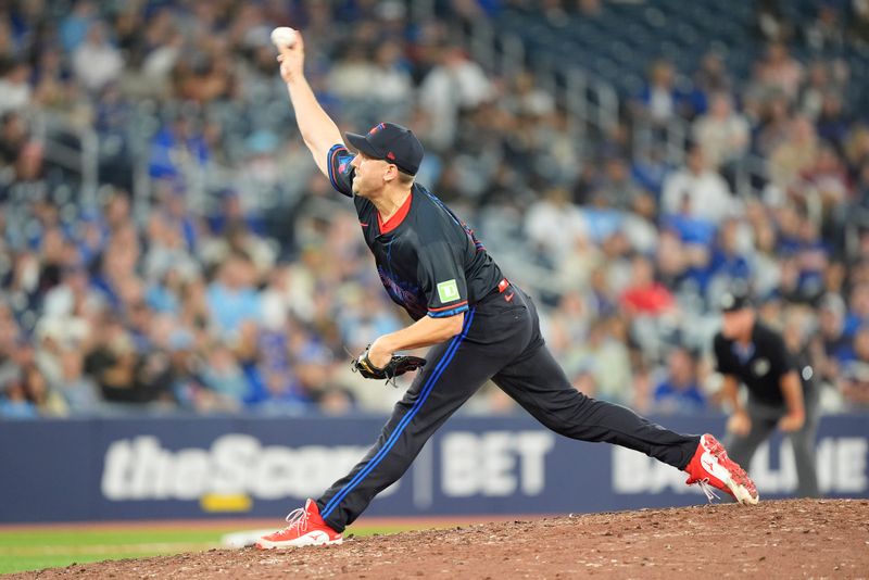 Sep 13, 2024; Toronto, Ontario, CAN; Toronto Blue Jays pitcher Erik Swanson (50) pitches to the St. Louis Cardinals during the eleventh inning at Rogers Centre. Mandatory Credit: John E. Sokolowski-Imagn Images