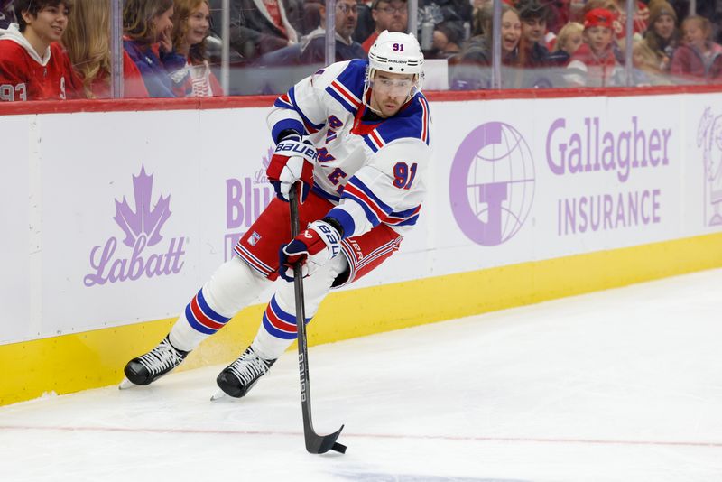 Nov 9, 2024; Detroit, Michigan, USA;  New York Rangers right wing Reilly Smith (91) skates with the puck against the Detroit Red Wings in the third period at Little Caesars Arena. Mandatory Credit: Rick Osentoski-Imagn Images