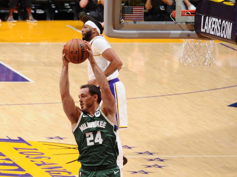 LOS ANGELES, CA - OCTOBER 15: Pat Connaughton #24 of the Milwaukee Bucks rebounds the ball during the game against the Los Angeles Lakers on October 15, 2023 at Crypto.Com Arena in Los Angeles, California. NOTE TO USER: User expressly acknowledges and agrees that, by downloading and/or using this Photograph, user is consenting to the terms and conditions of the Getty Images License Agreement. Mandatory Copyright Notice: Copyright 2023 NBAE (Photo by Adam Pantozzi/NBAE via Getty Images)