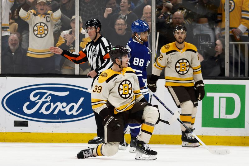 Mar 7, 2024; Boston, Massachusetts, USA; Boston Bruins center Morgan Geekie (39) celebrates his goal as Toronto Maple Leafs right wing William Nylander (88) skates away during the second period at TD Garden. Mandatory Credit: Winslow Townson-USA TODAY Sports