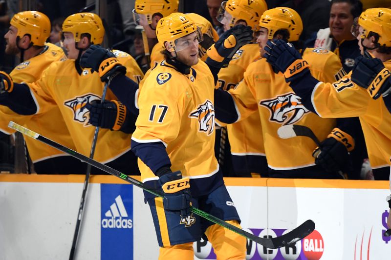 Mar 26, 2024; Nashville, Tennessee, USA; Nashville Predators center Mark Jankowski (17) celebrates with teammates after a goal during the second period against the Vegas Golden Knights at Bridgestone Arena. Mandatory Credit: Christopher Hanewinckel-USA TODAY Sports