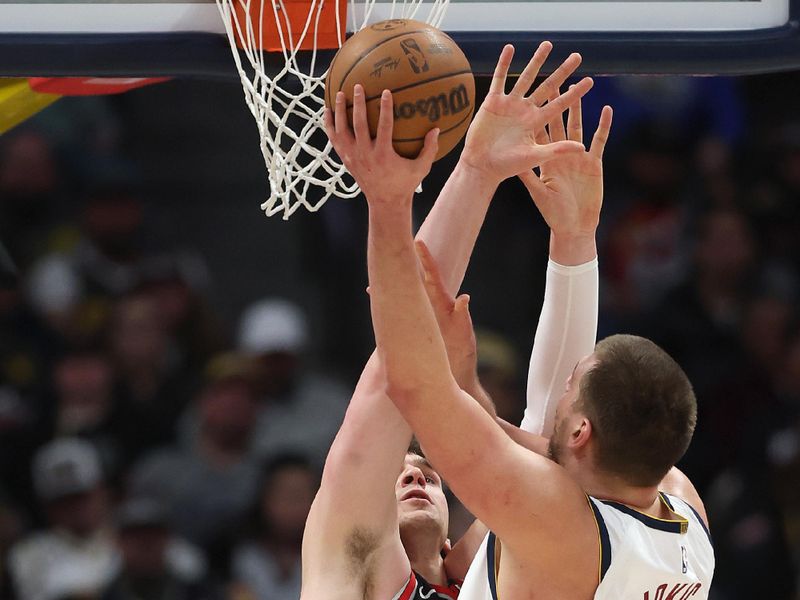 DENVER, COLORADO - FEBRUARY 10: Nikola Jokic #15 of the Denver Nuggets puts up a shot against Donovan Clingan #23 of the Portland Trail Blazers in the third quarter at Ball Arena on February 10, 2025 in Denver, Colorado. NOTE TO USER: User expressly acknowledges and agrees that, by downloading and or using this photograph, User is consenting to the terms and conditions of the Getty Images License Agreement.  (Photo by Matthew Stockman/Getty Images)