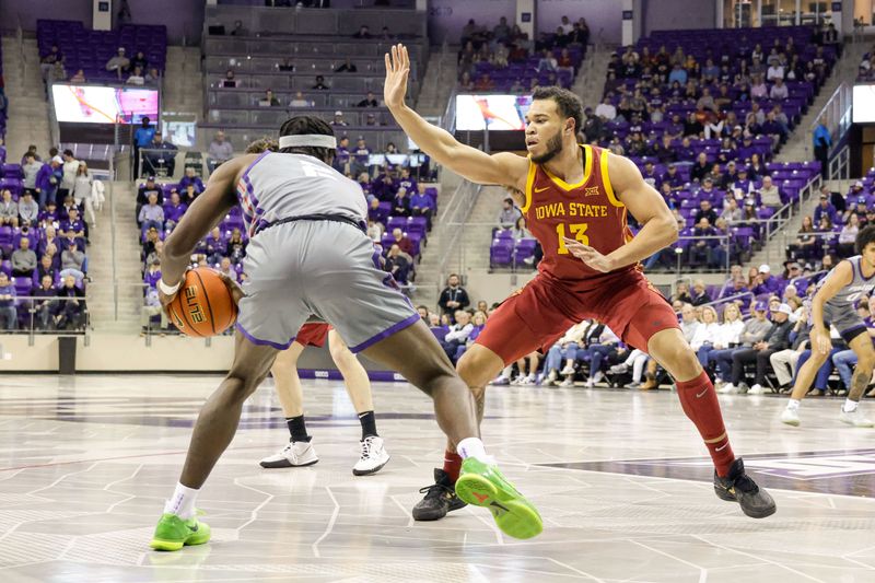 Jan 7, 2023; Fort Worth, Texas, USA; Iowa State Cyclones guard Jaren Holmes (13) guards TCU Horned Frogs forward Emanuel Miller (2) during the first half at Ed and Rae Schollmaier Arena. Mandatory Credit: Andrew Dieb-USA TODAY Sports