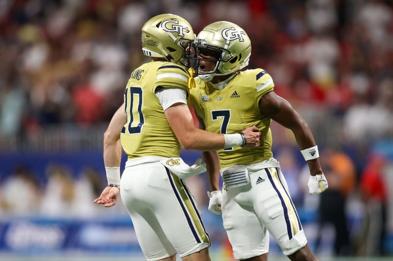 Sep 1, 2023; Atlanta, Georgia, USA; Georgia Tech Yellow Jackets wide receiver Chase Lane (7) celebrates after a touchdown with quarterback Haynes King (10) against the Louisville Cardinals in the second quarter at Mercedes-Benz Stadium. Mandatory Credit: Brett Davis-USA TODAY Sports