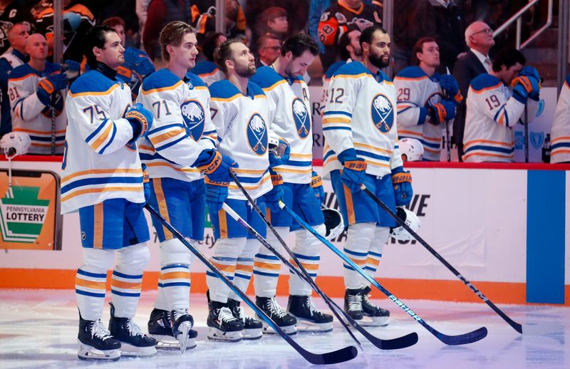 Oct 16, 2024; Pittsburgh, Pennsylvania, USA; The Buffalo Sabres starting lineup consisting of defenseman Connor Clifton (75), center Ryan McLeod (71), left wing Jason Zucker (17), defenseman Mattias Samuelsson (23), and right wing Jordan Greenway (12) stand for the national anthem against the Pittsburgh Penguins at PPG Paints Arena. Mandatory Credit: Charles LeClaire-Imagn Images