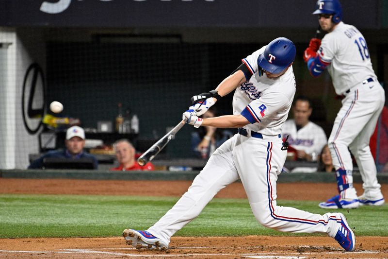 Oct 10, 2023; Arlington, Texas, USA; Texas Rangers shortstop Corey Seager (5) hits a solo home run against the Baltimore Orioles in the first inning during game three of the ALDS for the 2023 MLB playoffs at Globe Life Field. Mandatory Credit: Jerome Miron-USA TODAY Sports