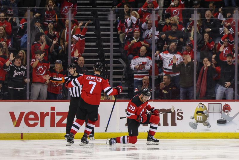 Dec 6, 2024; Newark, New Jersey, USA; New Jersey Devils right wing Timo Meier (28) celebrates his goal against the Seattle Kraken during the third period at Prudential Center. Mandatory Credit: Ed Mulholland-Imagn Images