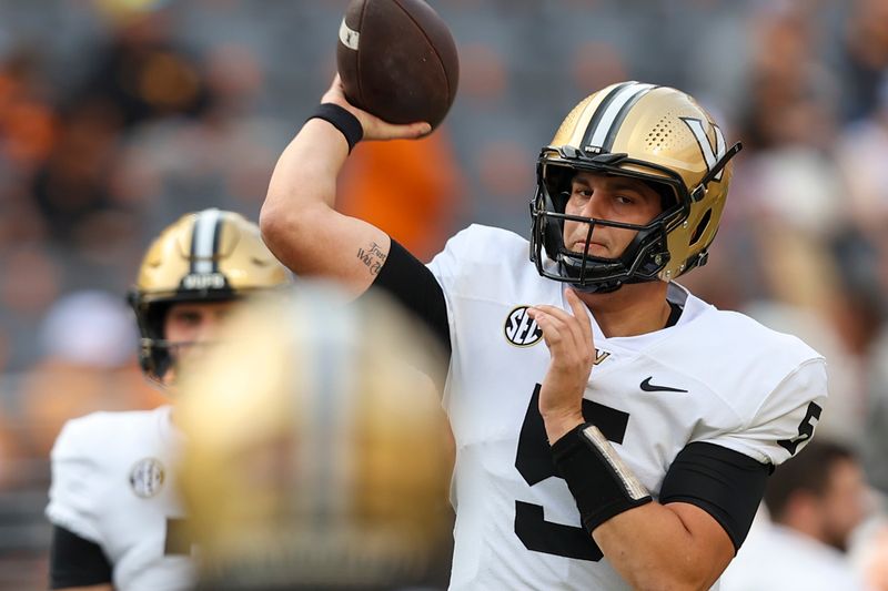 Nov 25, 2023; Knoxville, Tennessee, USA; Vanderbilt Commodores quarterback AJ Swann (5) passes the ball during warmups before the game against the Tennessee Volunteers at Neyland Stadium. Mandatory Credit: Randy Sartin-USA TODAY Sports