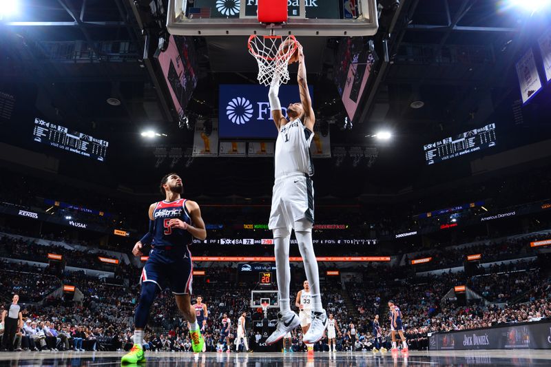 SAN ANTONIO, TX - JANUARY 29:  Victor Wembanyama #1 of the San Antonio Spurs dunks the ball during the game against the Washington Wizards on January 29, 2024 at the Frost Bank Center in San Antonio, Texas. NOTE TO USER: User expressly acknowledges and agrees that, by downloading and or using this photograph, user is consenting to the terms and conditions of the Getty Images License Agreement. Mandatory Copyright Notice: Copyright 2024 NBAE (Photos by Michael Gonzales/NBAE via Getty Images)