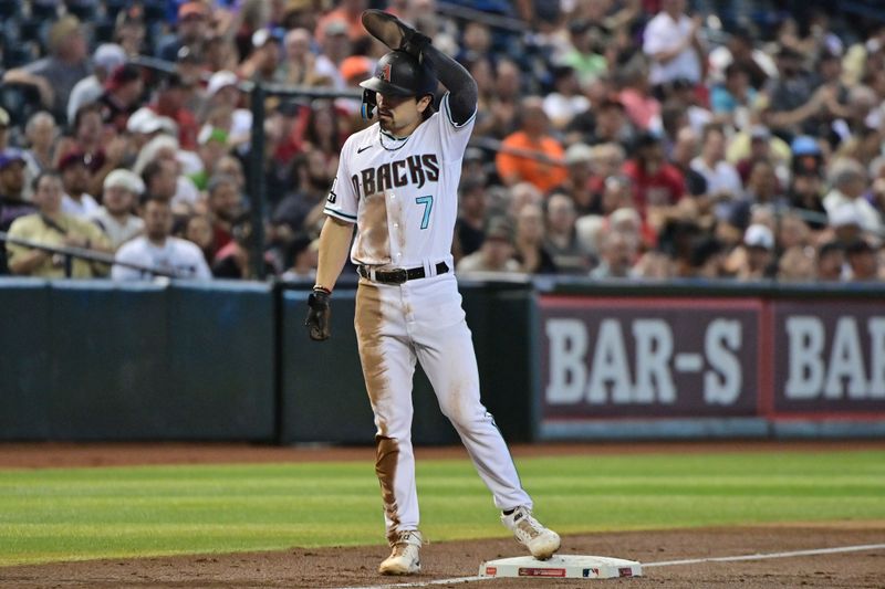 Sep 20, 2023; Phoenix, Arizona, USA;  Arizona Diamondbacks left fielder Corbin Carroll (7) celebrates after his 50th stolen base of the season in the third inning against the San Francisco Giants at Chase Field. Mandatory Credit: Matt Kartozian-USA TODAY Sports