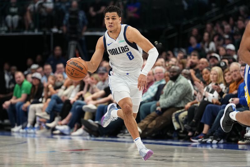 DALLAS, TX - MARCH 13: Josh Green #8 of the Dallas Mavericks dribbles the ball during the game against the Golden State Warriors on March 13, 2024 at the American Airlines Center in Dallas, Texas. NOTE TO USER: User expressly acknowledges and agrees that, by downloading and or using this photograph, User is consenting to the terms and conditions of the Getty Images License Agreement. Mandatory Copyright Notice: Copyright 2024 NBAE (Photo by Glenn James/NBAE via Getty Images)