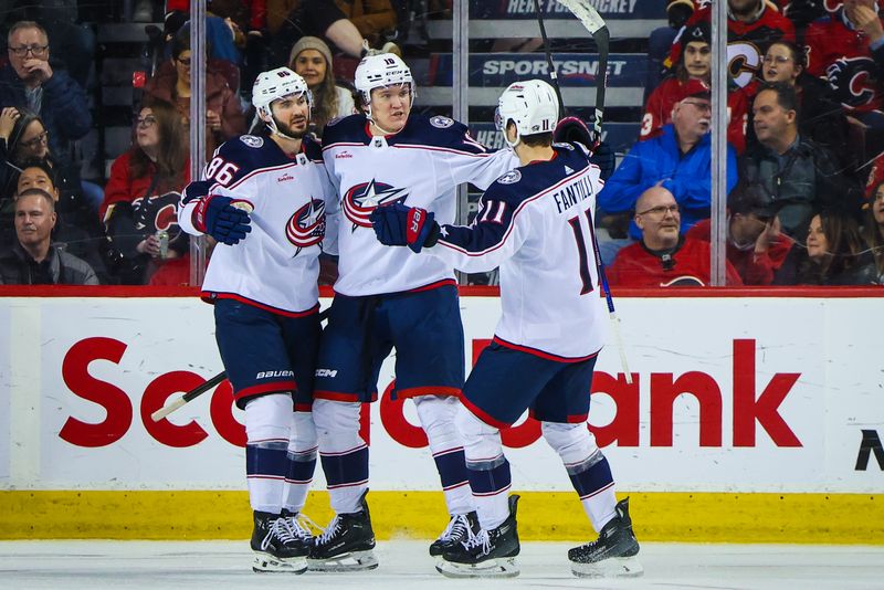 Jan 25, 2024; Calgary, Alberta, CAN; Columbus Blue Jackets left wing Dmitri Voronkov (10) celebrates his goal with teammates against the Calgary Flames during the third period at Scotiabank Saddledome. Mandatory Credit: Sergei Belski-USA TODAY Sports