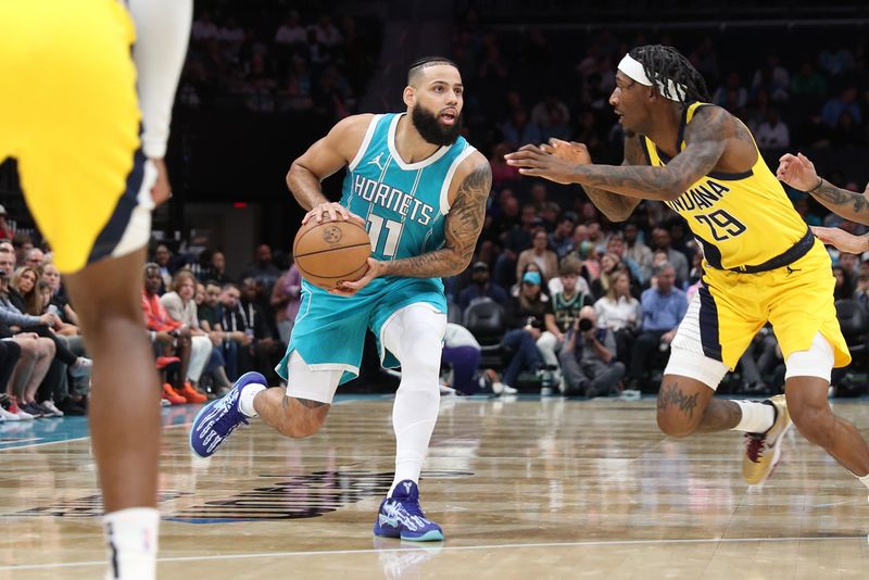 CHARLOTTE, NC - NOVEMBER 8: Cody Martin #11 of the Charlotte Hornets handles the ball during the game against the Indiana Pacers on November 8, 2024 at Spectrum Center in Charlotte, North Carolina. NOTE TO USER: User expressly acknowledges and agrees that, by downloading and or using this photograph, User is consenting to the terms and conditions of the Getty Images License Agreement. Mandatory Copyright Notice: Copyright 2024 NBAE (Photo by Brock Williams-Smith/NBAE via Getty Images)