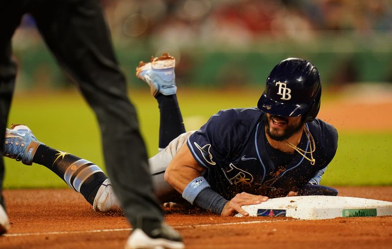 May 13, 2024; Boston, Massachusetts, USA; Tampa Bay Rays shortstop Jose Caballero (7) steals third base against the Boston Red Sox in the forth inning at Fenway Park. Mandatory Credit: David Butler II-USA TODAY Sports