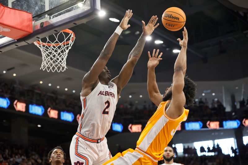 Mar 4, 2023; Auburn, Alabama, USA; Tennessee Volunteers guard Josiah-Jordan James (30) shoots the ball against Auburn Tigers forward Jaylin Williams (2) during the first half at Neville Arena. Mandatory Credit: John Reed-USA TODAY Sports