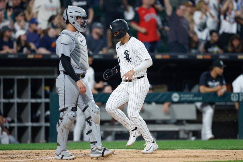 Jun 3, 2025; Chicago, Illinois, USA; Chicago White Sox first baseman Miguel Vargas (20) scores against the Detroit Tigers during the seventh inning at Rate Field. Mandatory Credit: Kamil Krzaczynski-Imagn Images