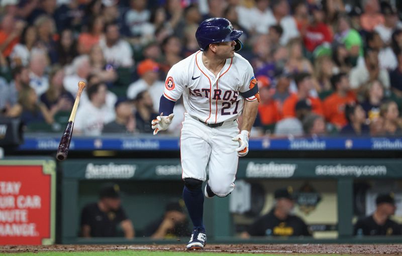 Jul 30, 2024; Houston, Texas, USA; Houston Astros second baseman Jose Altuve (27) hits a single during the third inning against the Pittsburgh Pirates at Minute Maid Park. Mandatory Credit: Troy Taormina-USA TODAY Sports